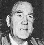 A black and white photo of an older man.