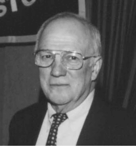 A black and white photo of an older man.