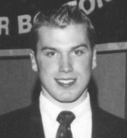 A young man in a suit and tie.