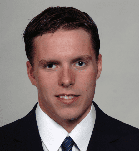 A man in suit and tie posing for the camera.