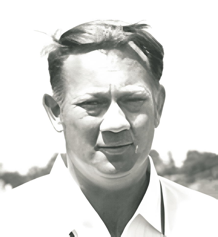 A man with short hair and wearing white shirt.