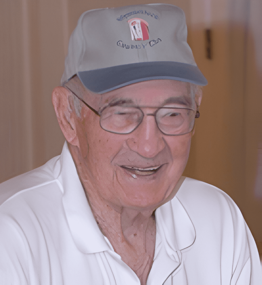 A man wearing glasses and a hat.