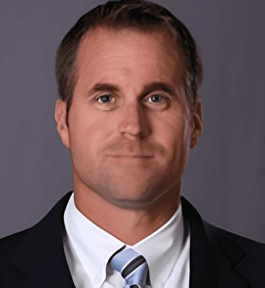 A man in suit and tie with a white shirt.