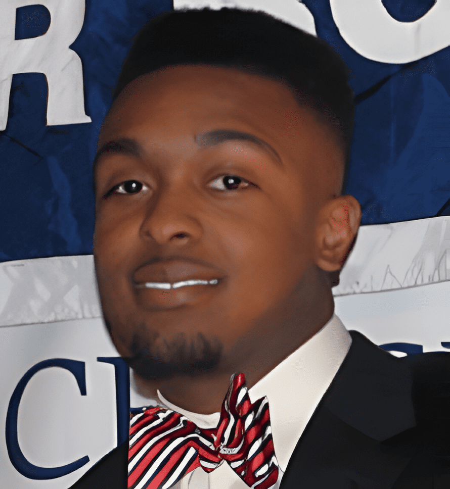 A man in a suit and bow tie.