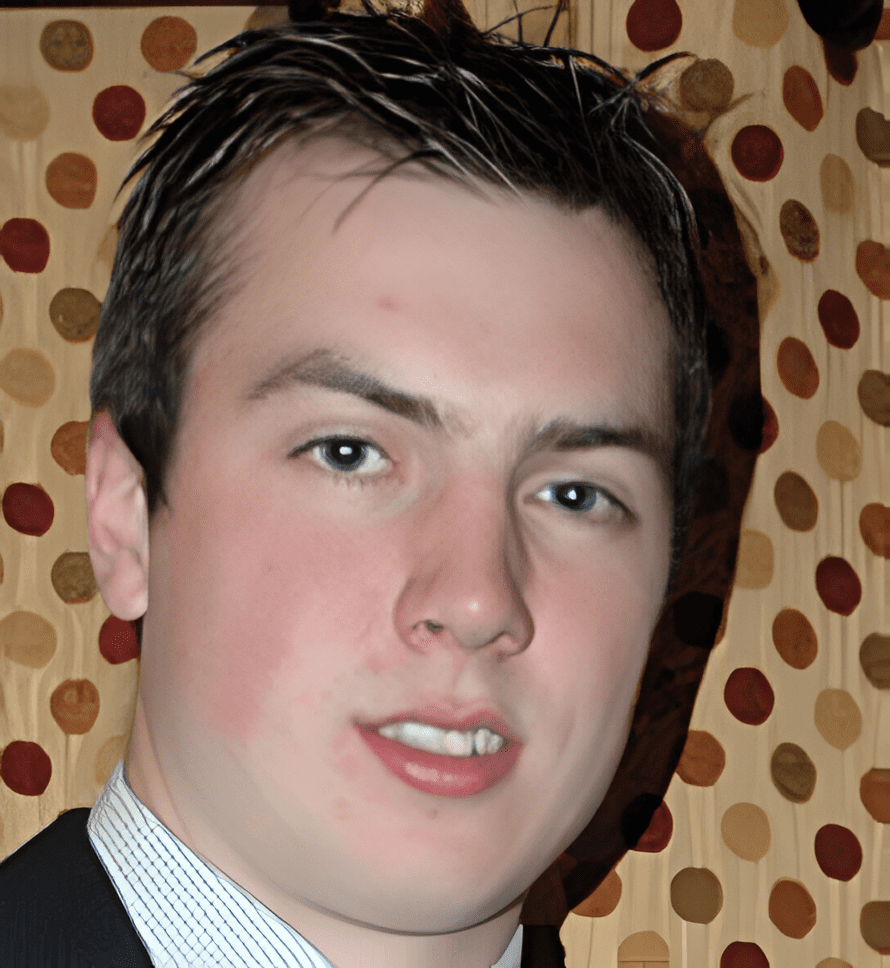 A man in suit and tie with polka dots background