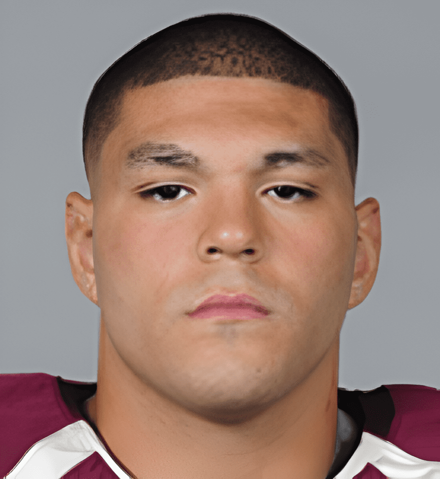 A close up of a football player with a helmet on