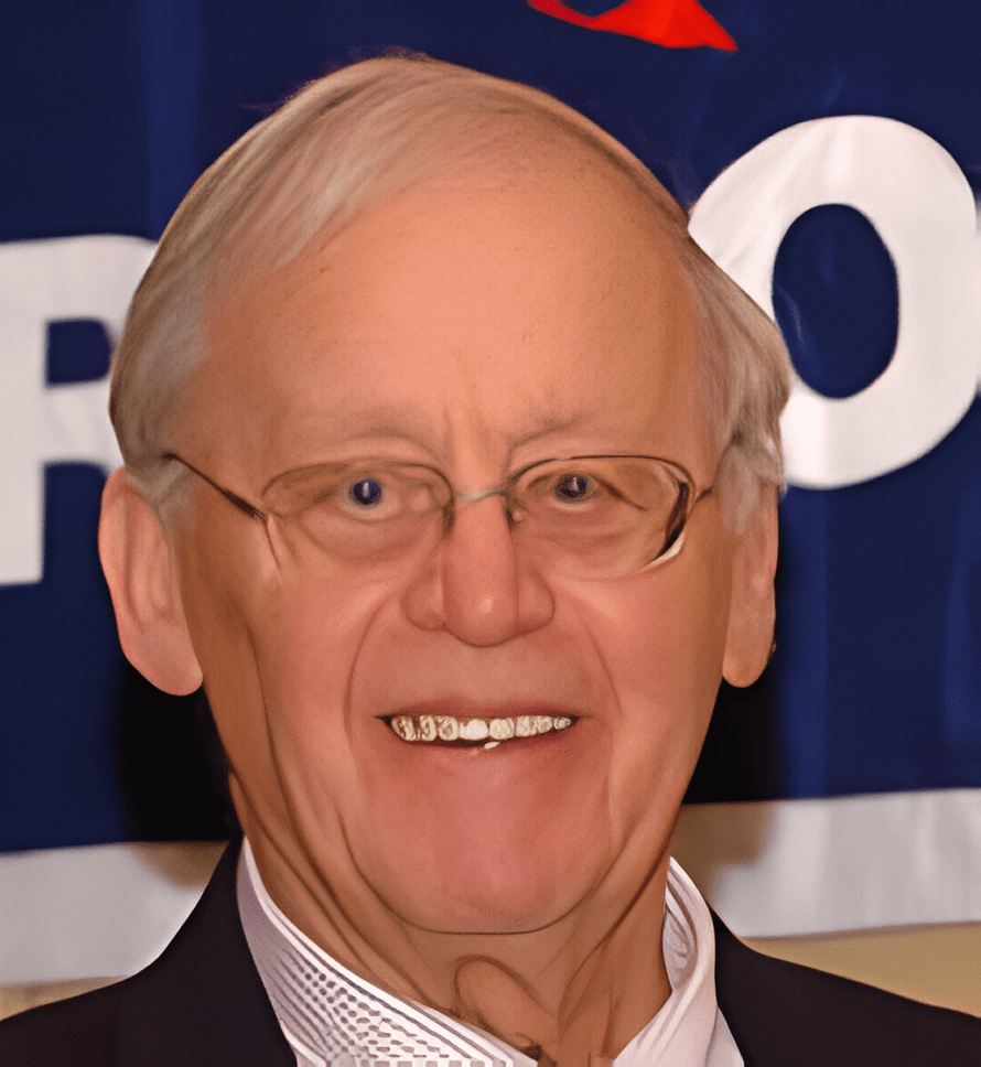 A man with glasses and a suit on.