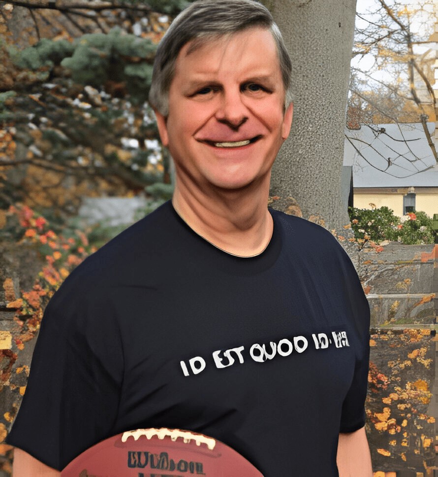 A man holding a football in his hand.